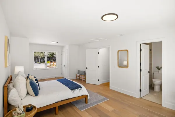 a bedroom with a bed and window