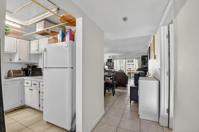 a utility room with cabinets dryer and washer