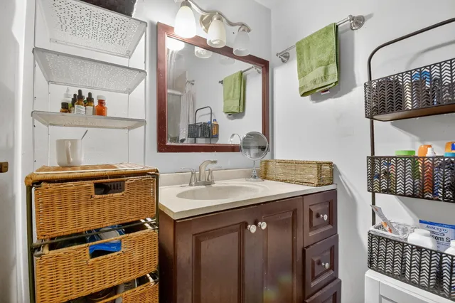 a bathroom with a sink and a mirror