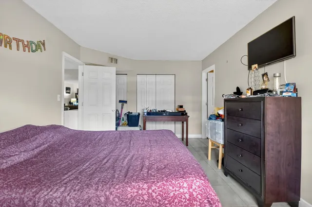 a bed room with a bed and television