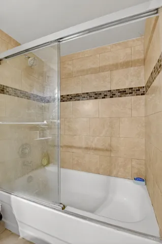 a bathroom with a shower and a bathtub