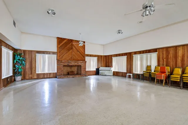 a view of a livingroom with furniture water heater and a window