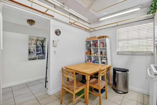a dining room with a table and chairs