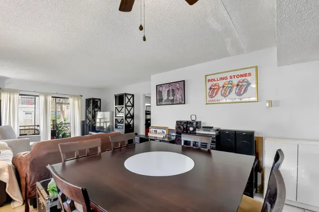 a dining room with furniture and window