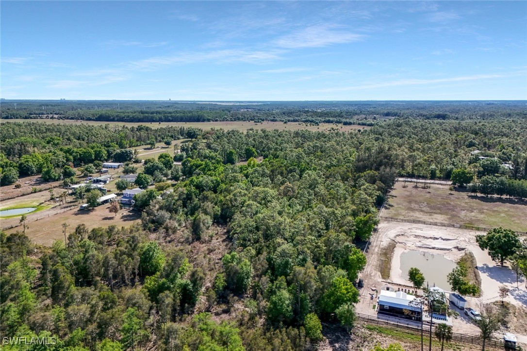 12571 Shawnee Road Fort Myers, FL 33913 - Photo 5 of 15 an aerial view of a house with a garden
