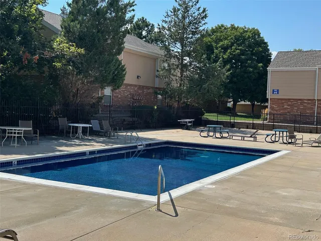 a view of a house with a yard and tree s