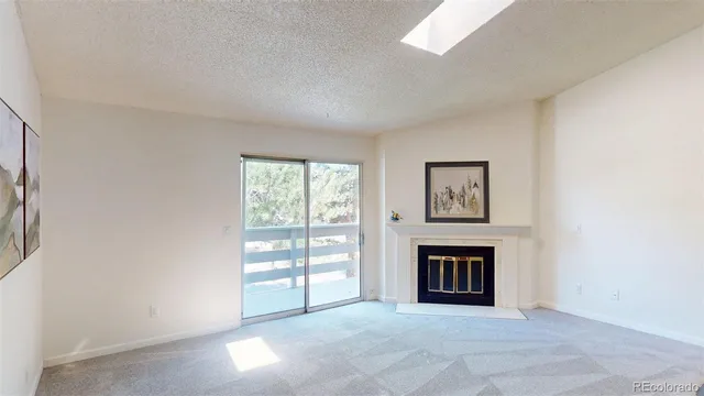 a view of an empty room with glass door