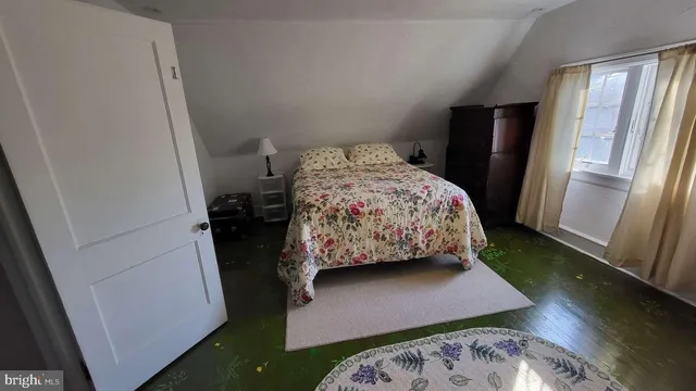 a wooden deck with trees in front of it