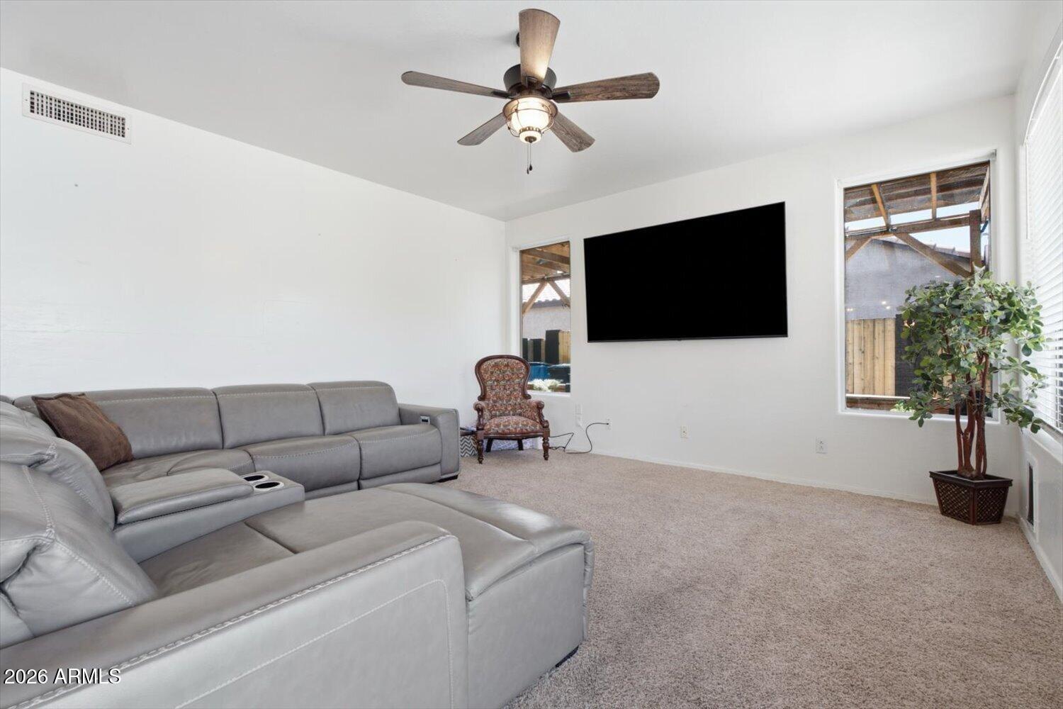 1894 East Mineral Road Gilbert, AZ 85234 - Photo 13 of 48 a living room with furniture and a flat screen tv