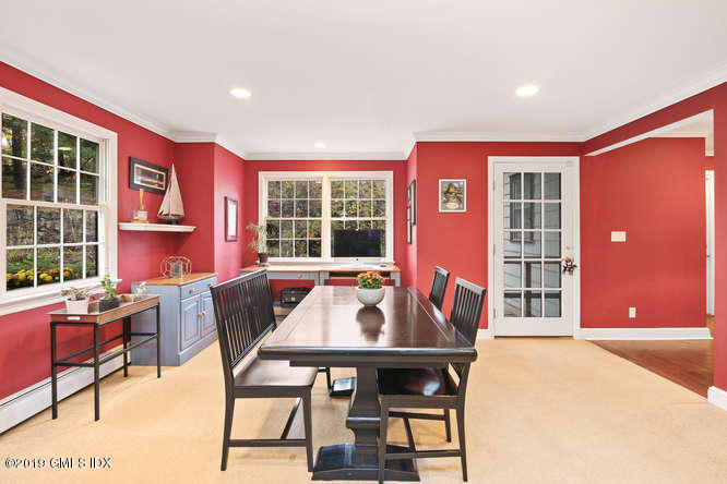 42 Indian Field Road Greenwich, CT 06830 - Photo 15 of 43 a view of a dining room with furniture and chandelier
