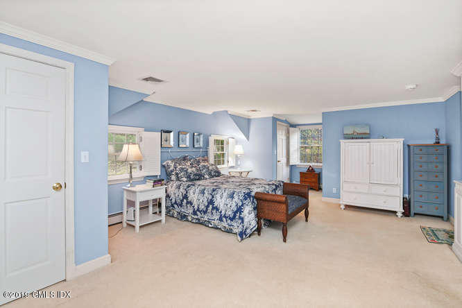 42 Indian Field Road Greenwich, CT 06830 - Photo 22 of 43 a living room with furniture and a bed