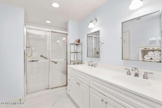 42 Indian Field Road Greenwich, CT 06830 - Photo 25 of 43 a bathroom with a double vanity sink mirror and double