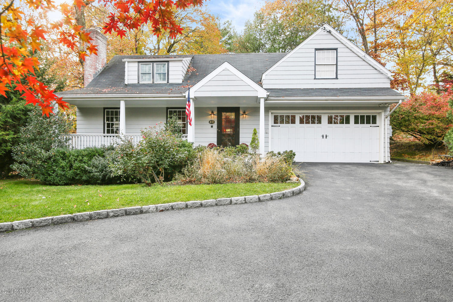 42 Indian Field Road Greenwich, CT 06830 - Photo 3 of 43 a front view of a house with a garden and deck