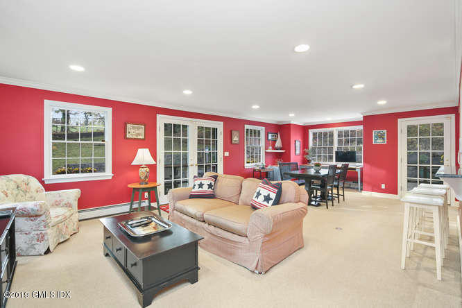 42 Indian Field Road Greenwich, CT 06830 - Photo 9 of 43 a living room with furniture and a large window