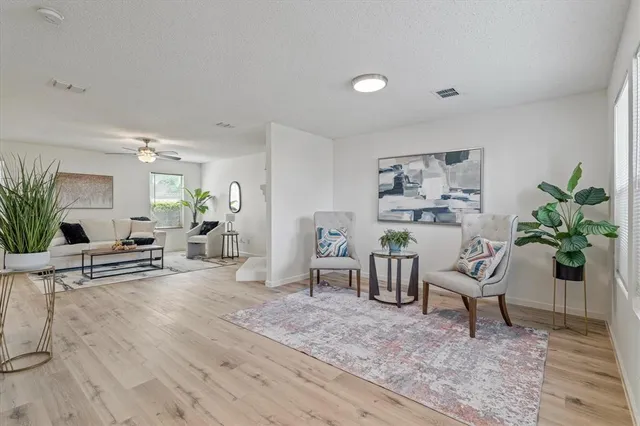 a living room with furniture and a table