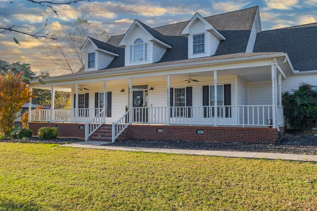 a front view of a house with a swimming pool