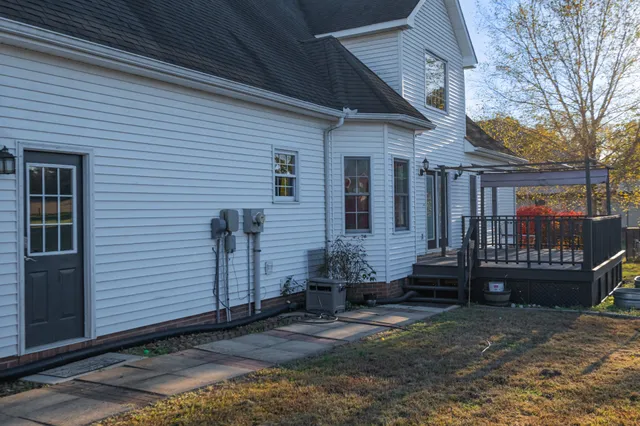 a kitchen with a refrigerator and a sink