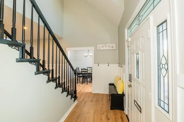 a kitchen with a refrigerator and a stove