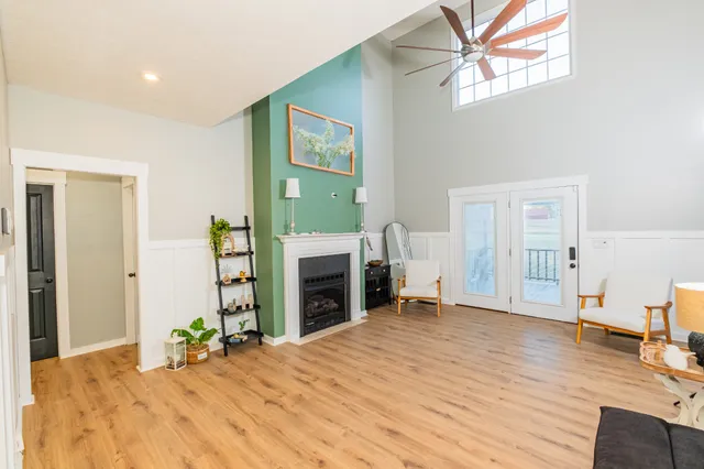 a kitchen with a stove and a wooden floors