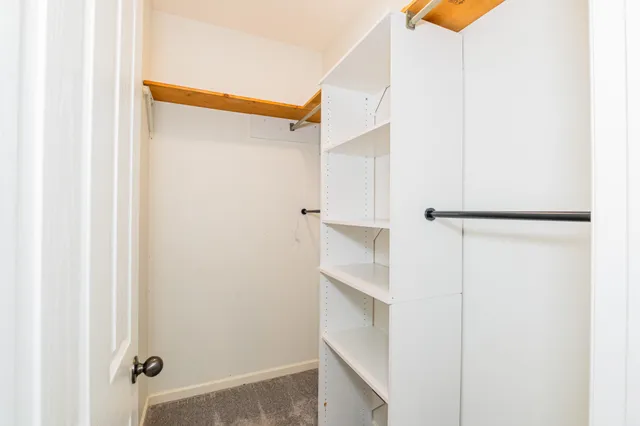 a bathroom with a double vanity sink mirror and toilet