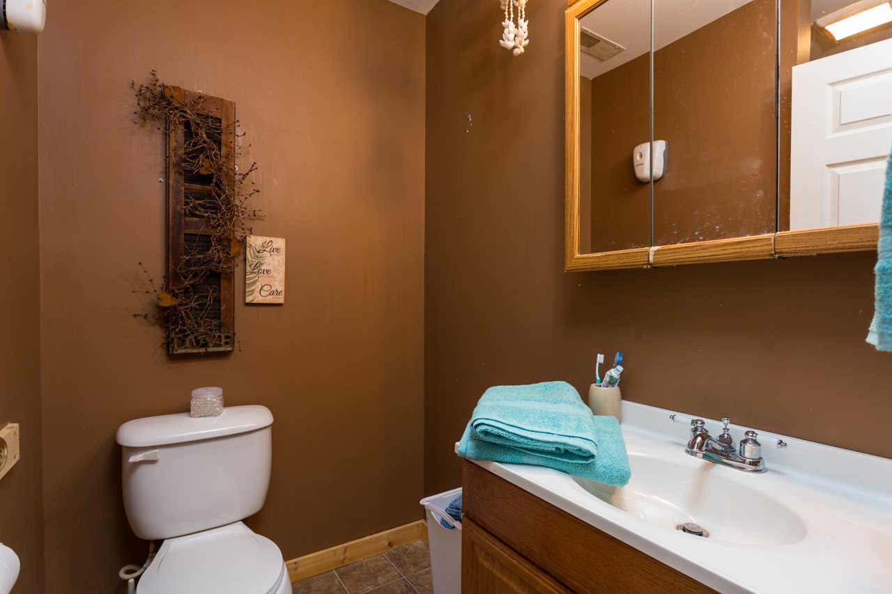 1273 Union Church Road Churchville, VA 24421 - Photo 23 of 48 a bathroom with a toilet sink and mirror