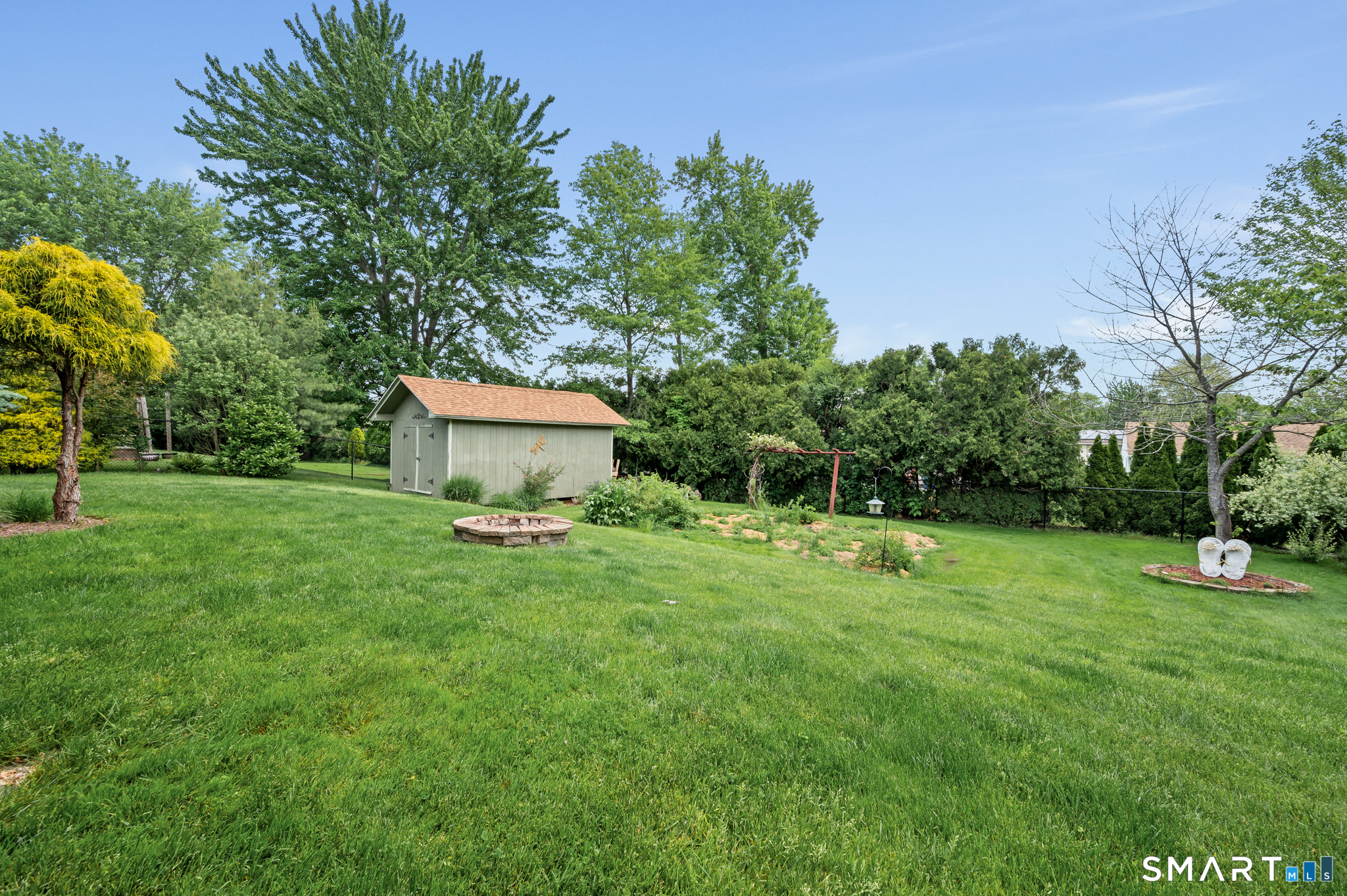 201 Ridge Crest Circle Wethersfield, CT 06109 - Photo 27 of 35 a view of a house with a backyard
