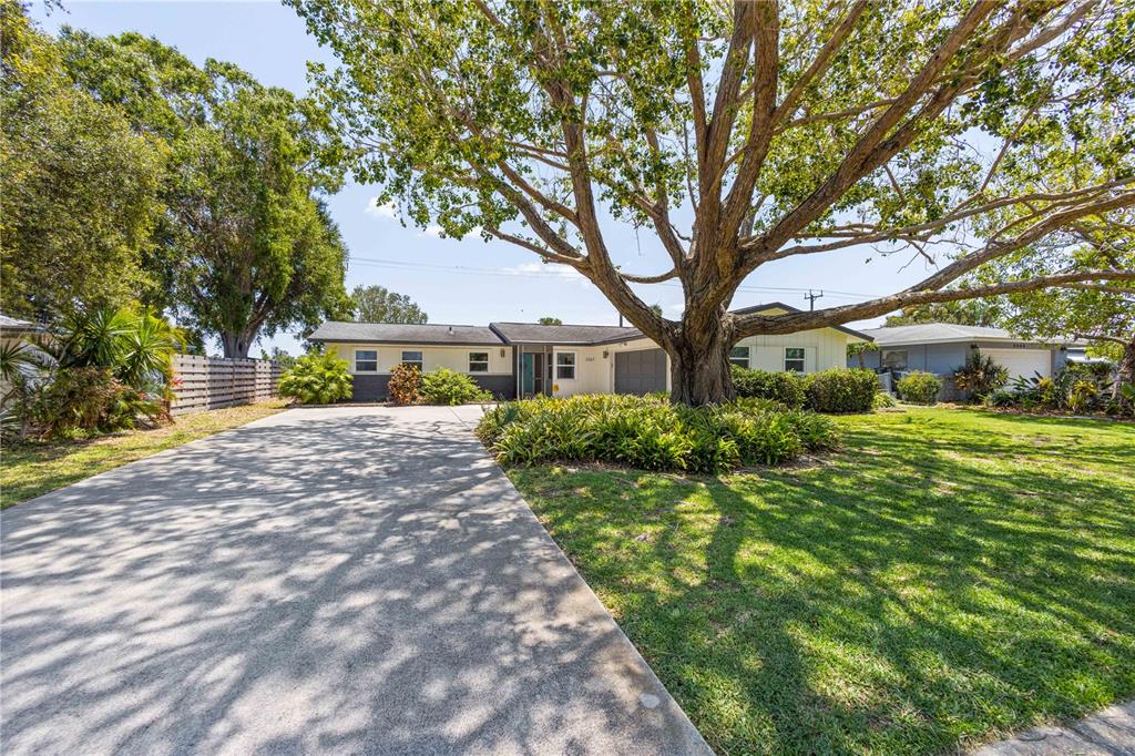 3267 South Lockwood Ridge Road Sarasota, FL 34239 - Photo 1 of 1 a front view of a house with a yard