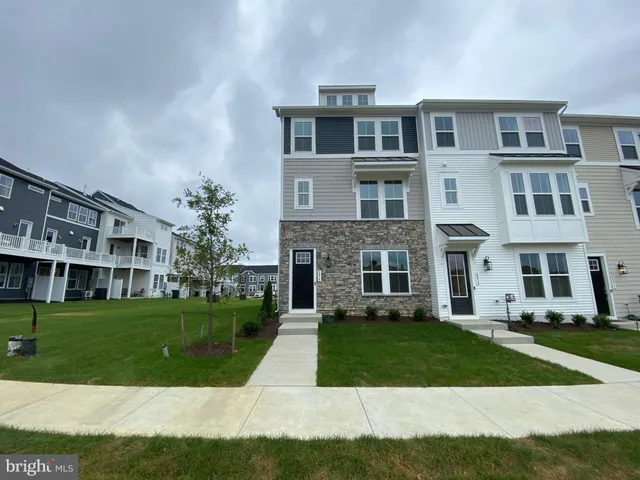 a front view of a building with a yard