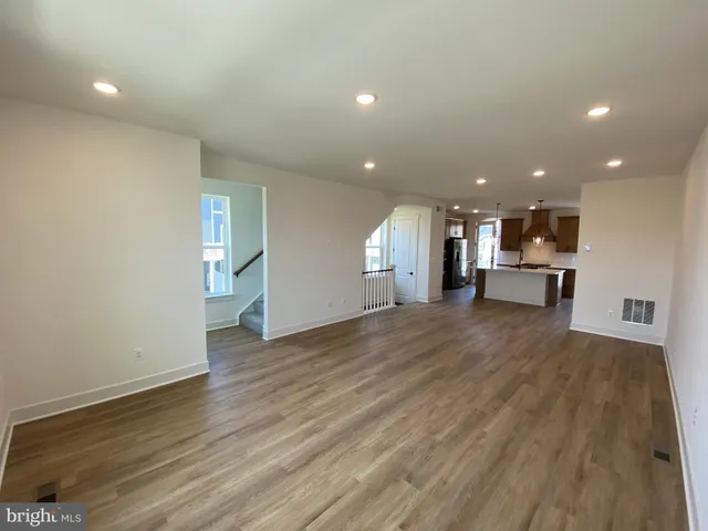 a kitchen with a table and chairs in it