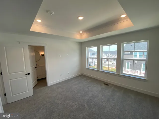 a bathroom with a double vanity sink mirror and toilet