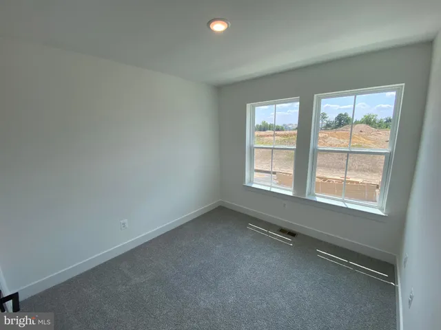 an empty room with a hallway