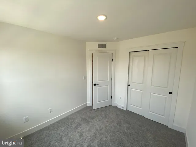 a bathroom with a sink toilet and a mirror