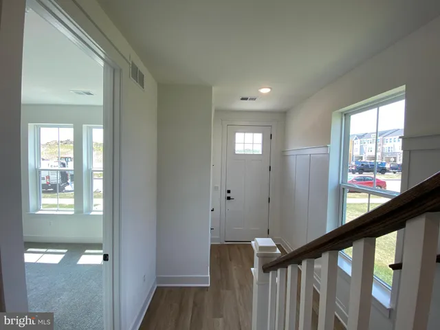 a view of a hallway with windows