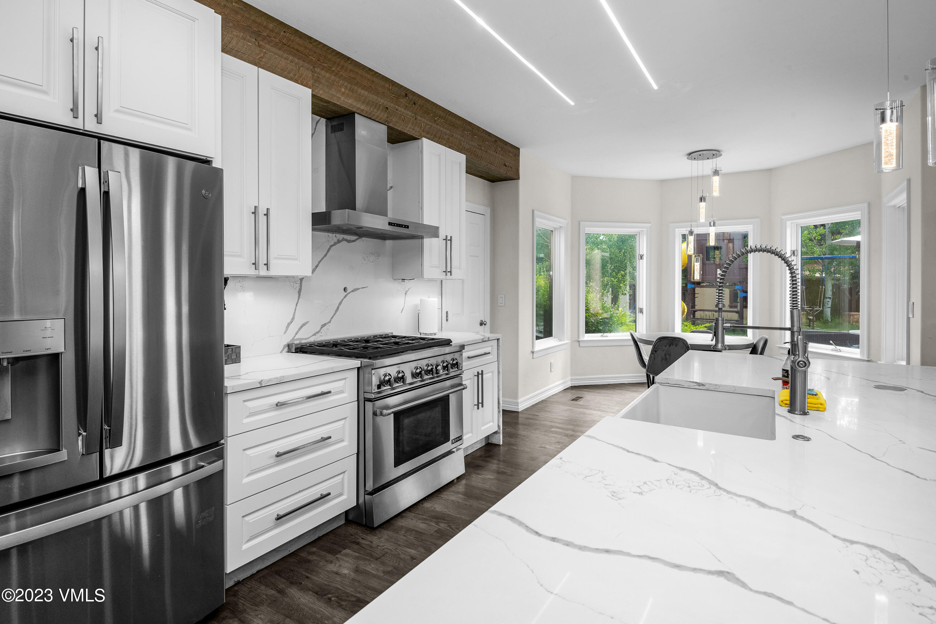 305 Red Fox Gypsum, CO 81637 - Photo 14 of 50 a kitchen with stainless steel appliances granite countertop a refrigerator stove and sink