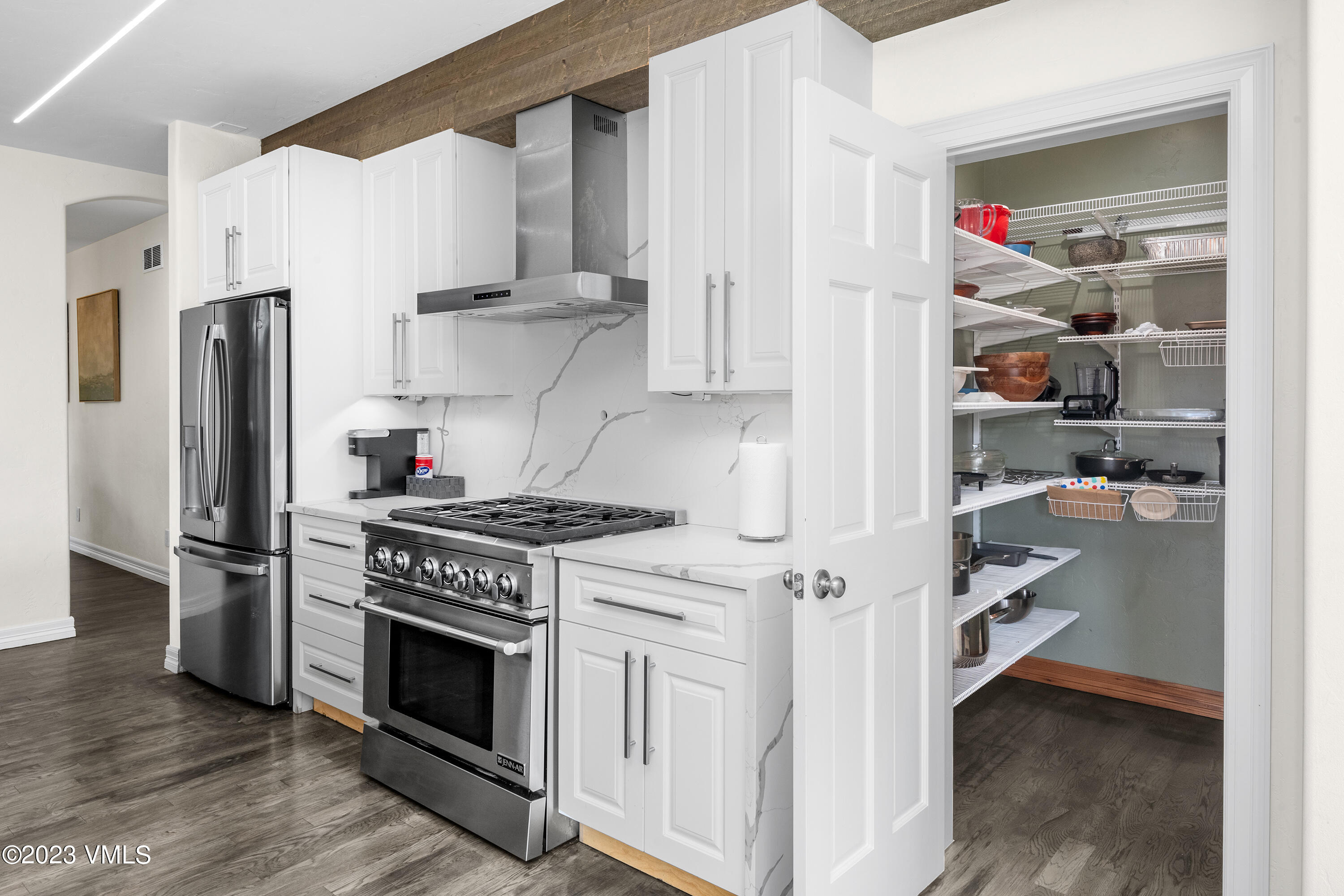 305 Red Fox Gypsum, CO 81637 - Photo 15 of 50 a kitchen with stainless steel appliances a stove a refrigerator and a refrigerator