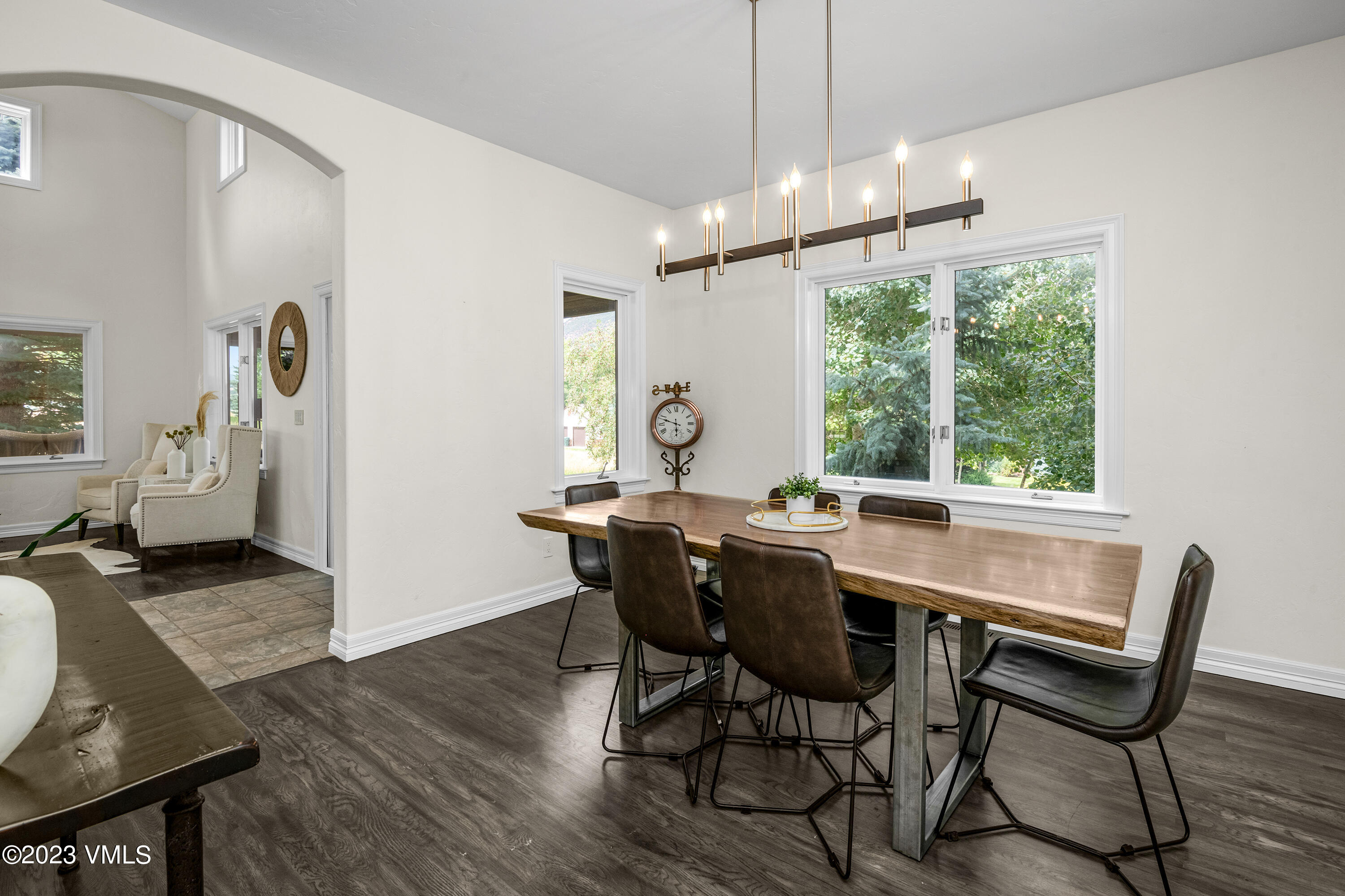 305 Red Fox Gypsum, CO 81637 - Photo 16 of 50 a view of a dining room with furniture window and wooden floor
