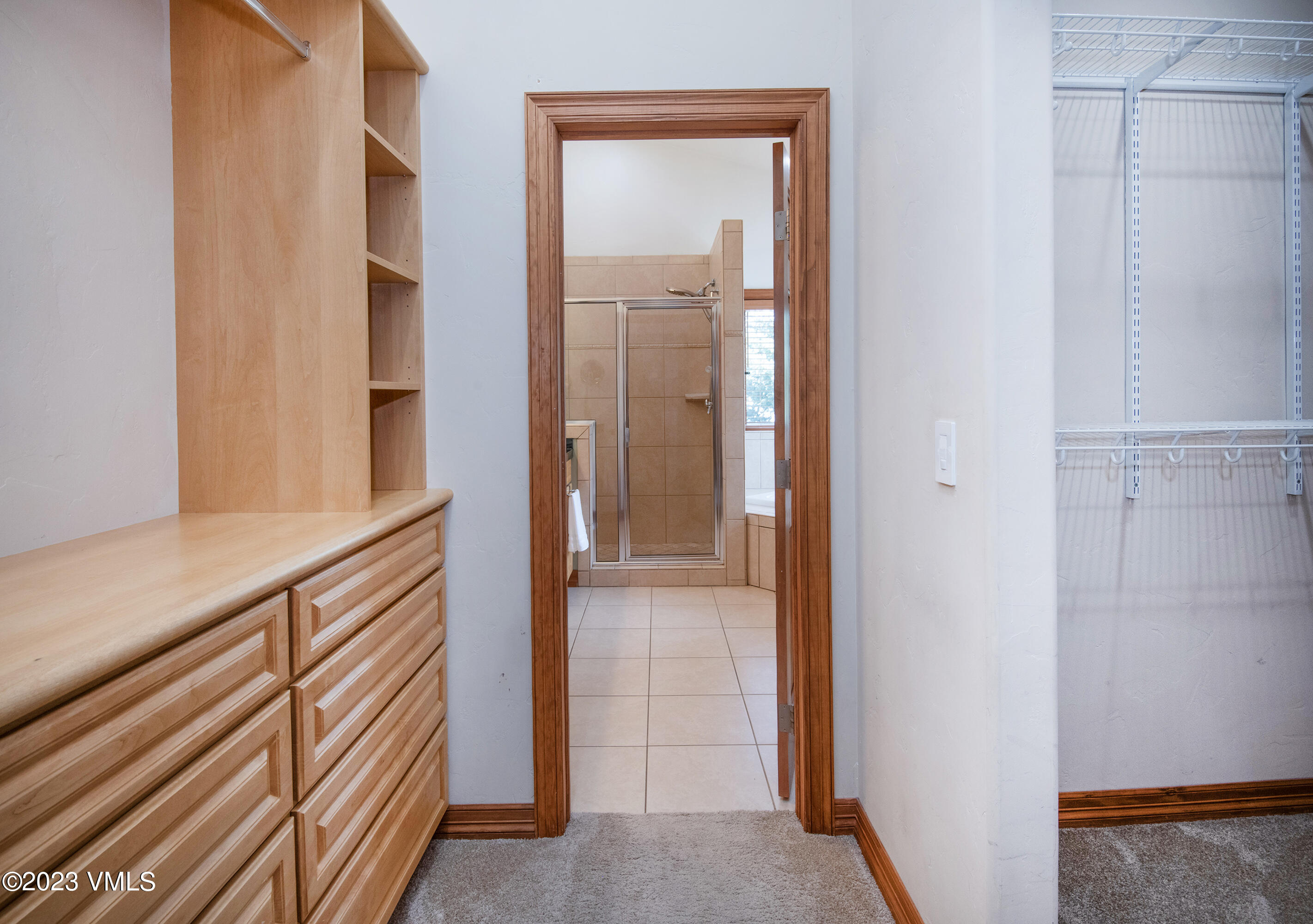 305 Red Fox Gypsum, CO 81637 - Photo 22 of 50 a view of a hallway with wooden floor and closet