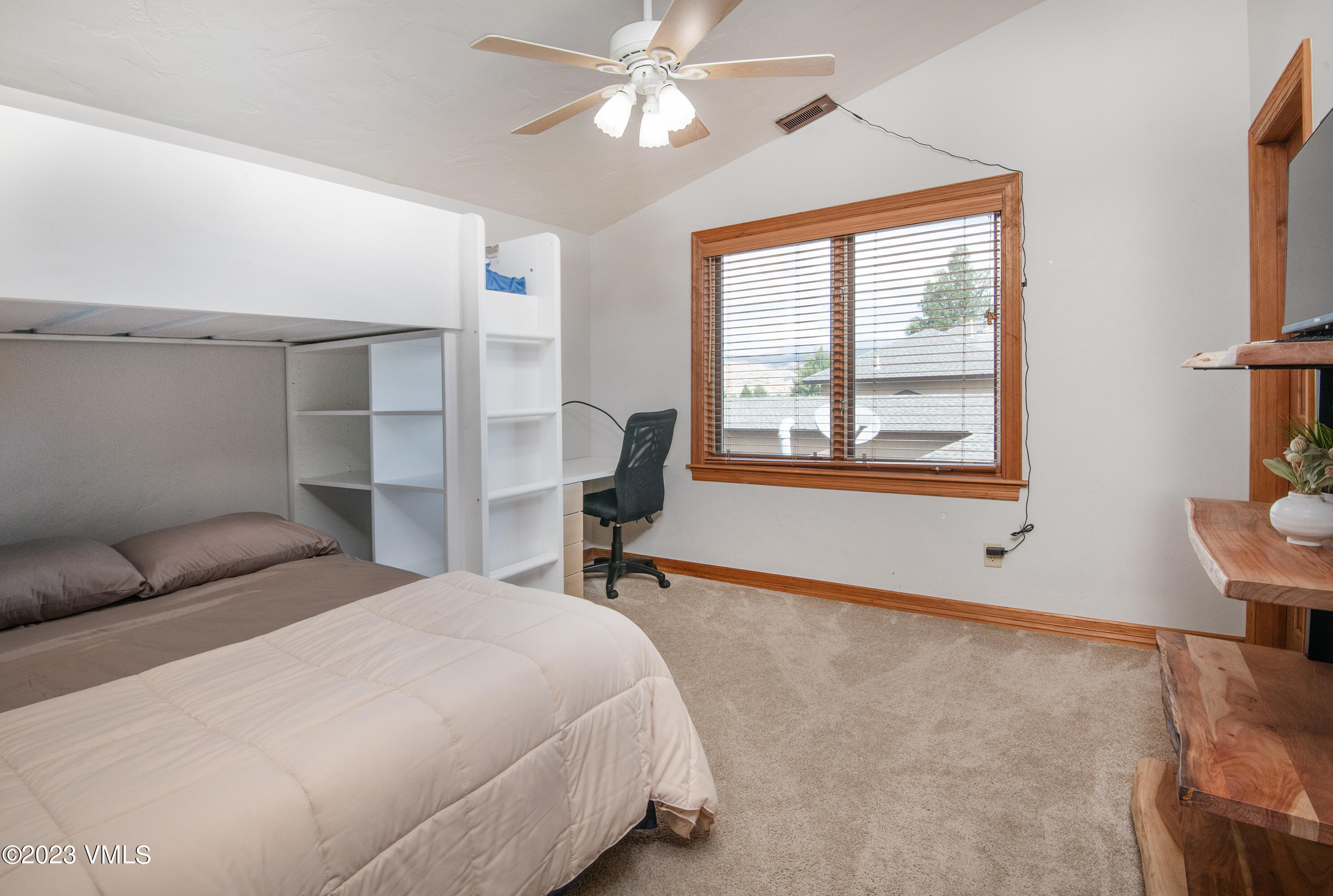 305 Red Fox Gypsum, CO 81637 - Photo 28 of 50 a bedroom with a bed dresser and a window