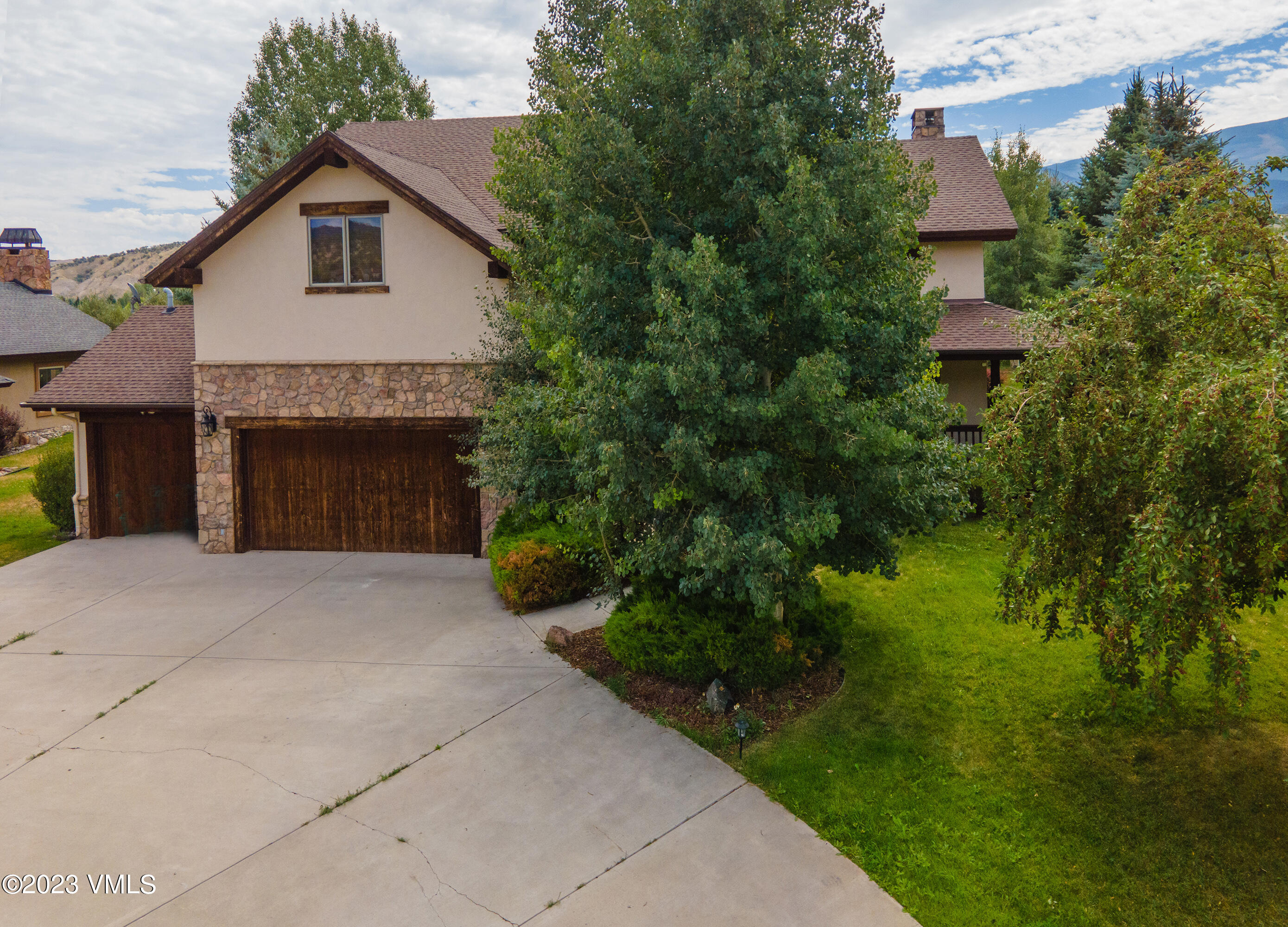 305 Red Fox Gypsum, CO 81637 - Photo 3 of 50 a front view of a house with a yard and garage