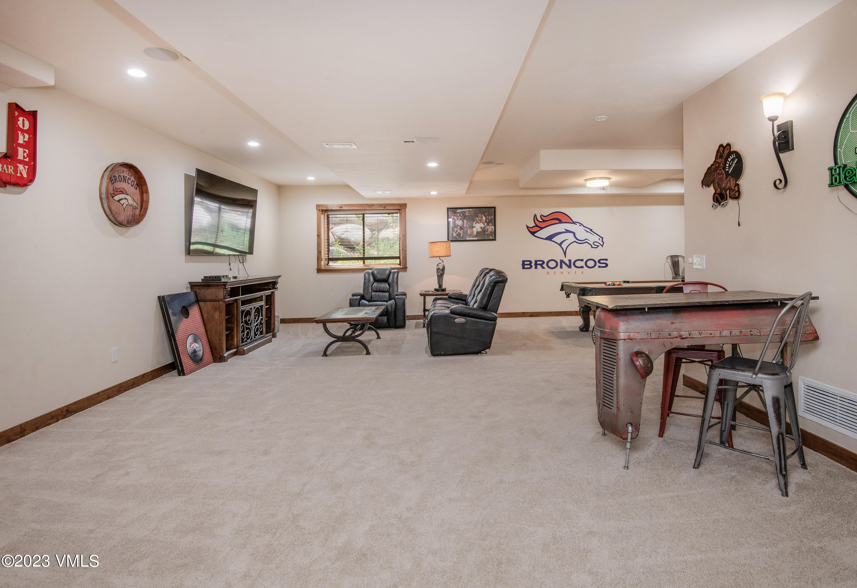 305 Red Fox Gypsum, CO 81637 - Photo 31 of 50 a living room with furniture and a flat screen tv