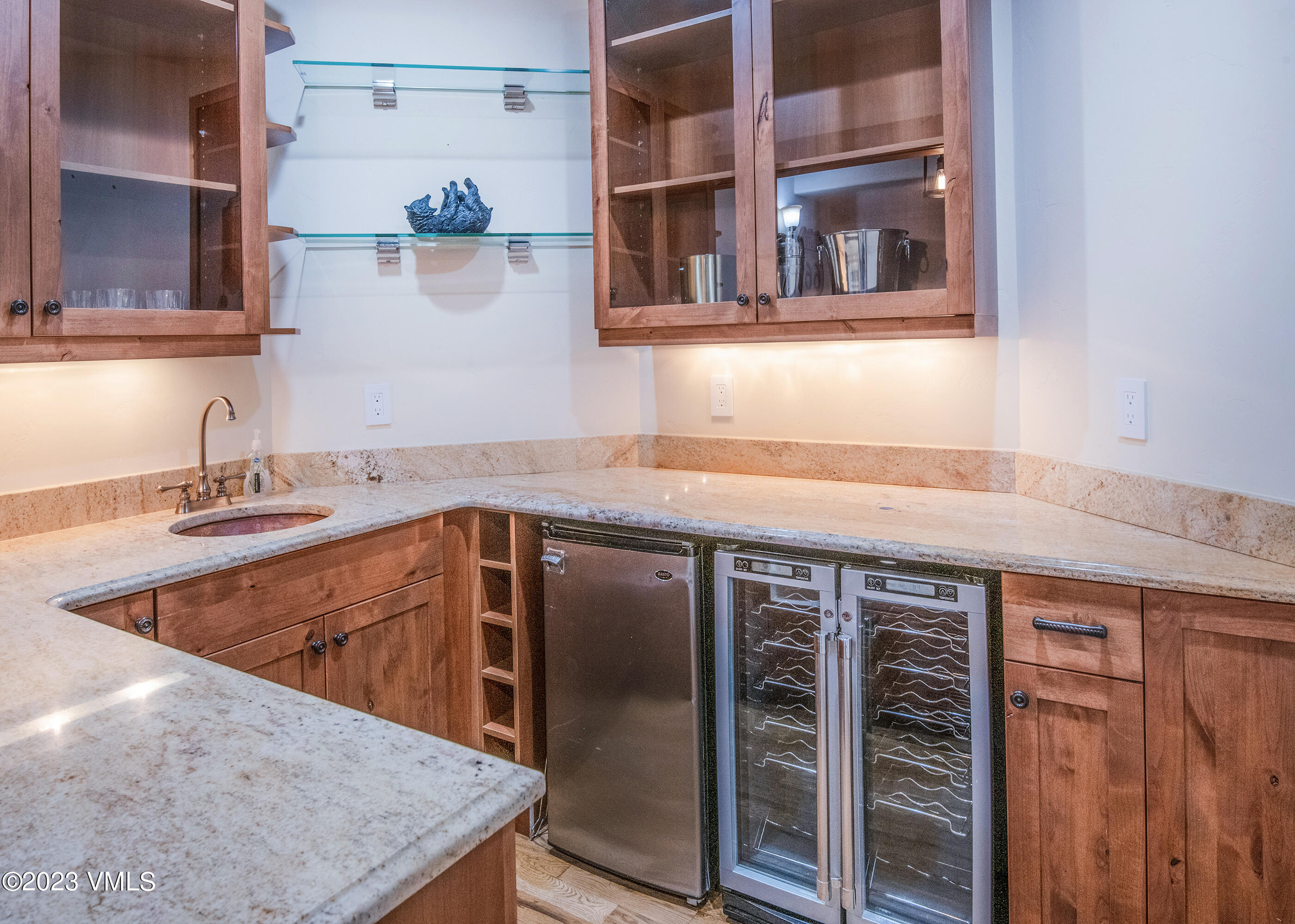 305 Red Fox Gypsum, CO 81637 - Photo 34 of 50 a kitchen with stainless steel appliances granite countertop a sink and a refrigerator