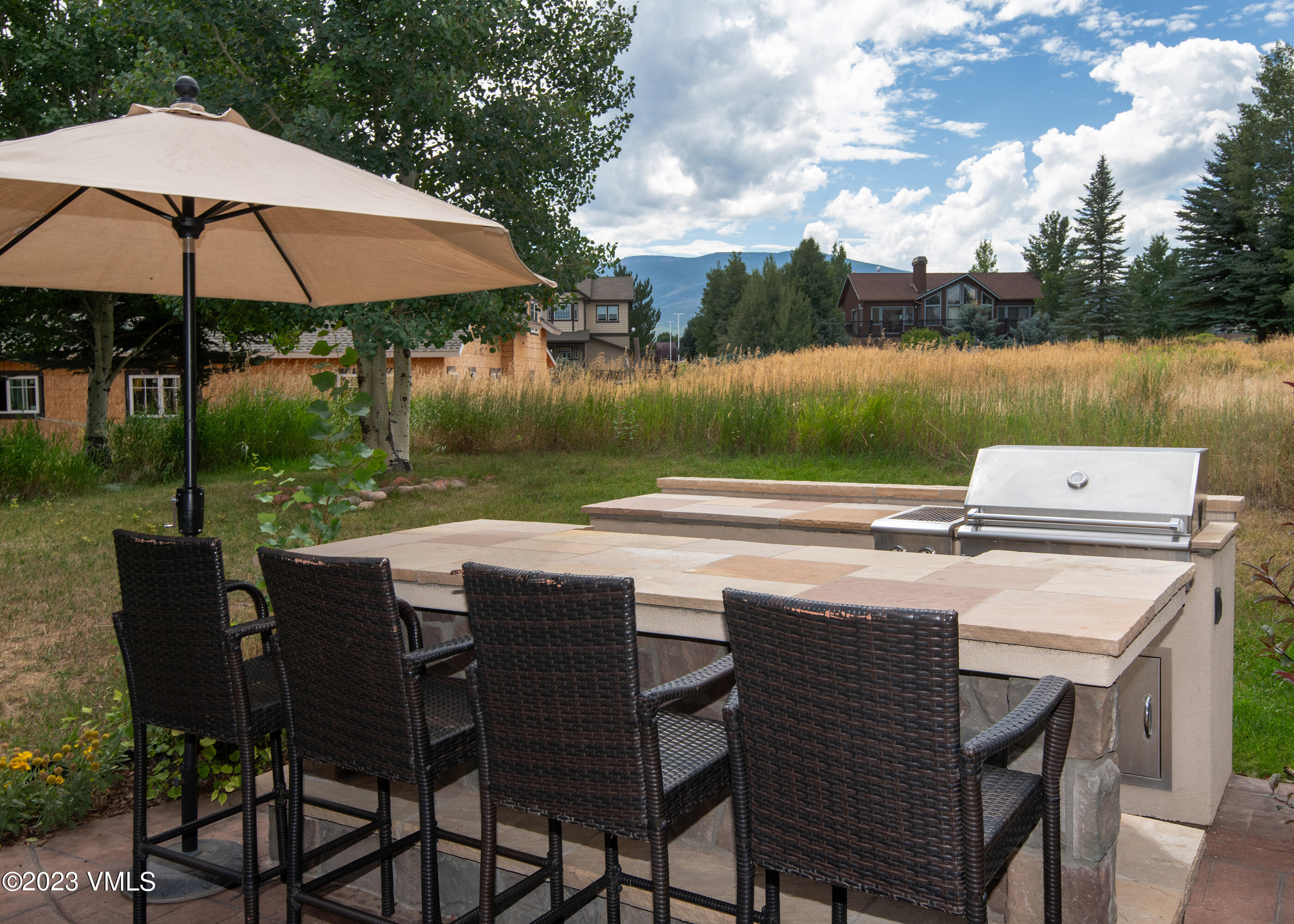305 Red Fox Gypsum, CO 81637 - Photo 37 of 50 a patio with a table and chairs