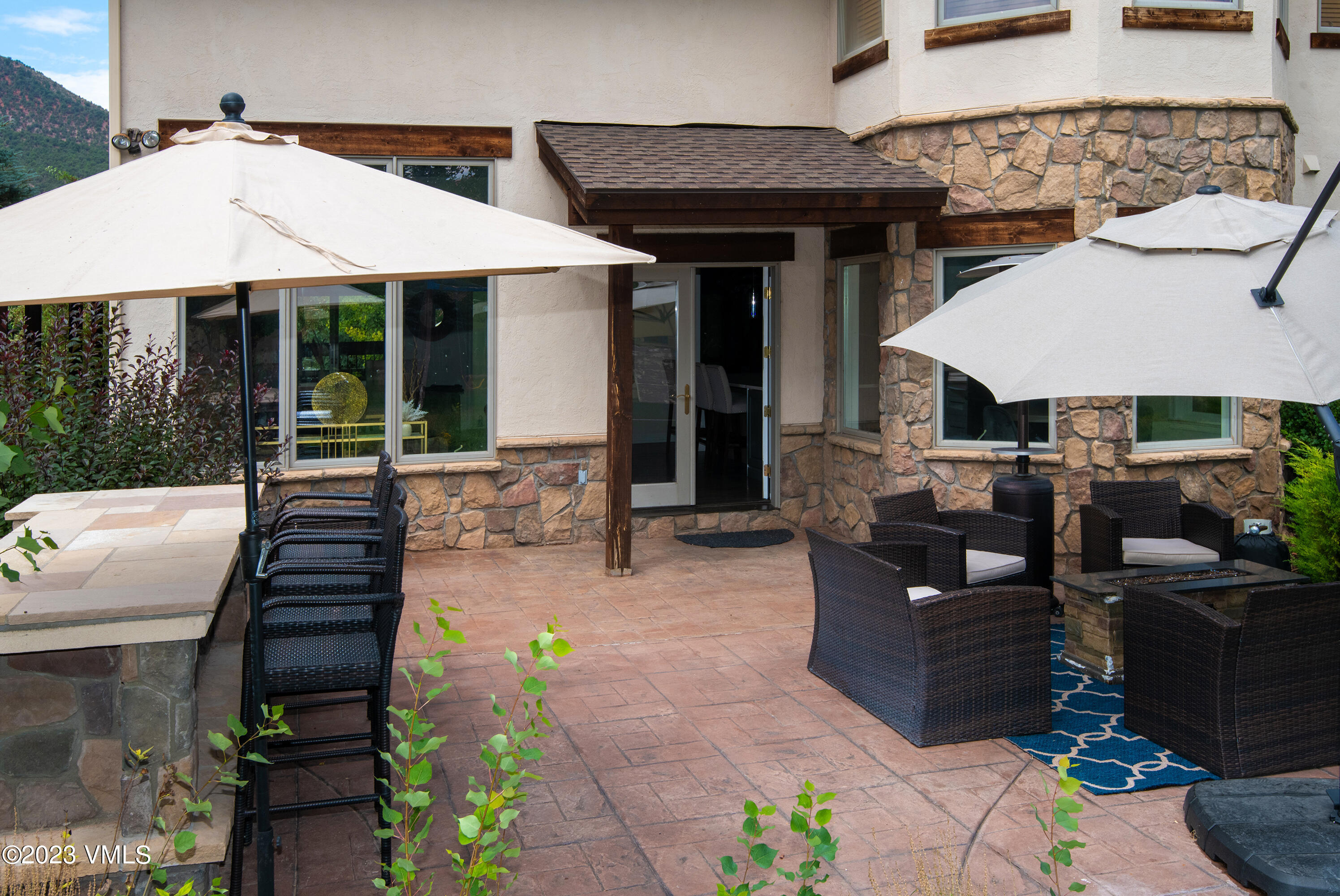 305 Red Fox Gypsum, CO 81637 - Photo 38 of 50 a front view of a house with garden and patio