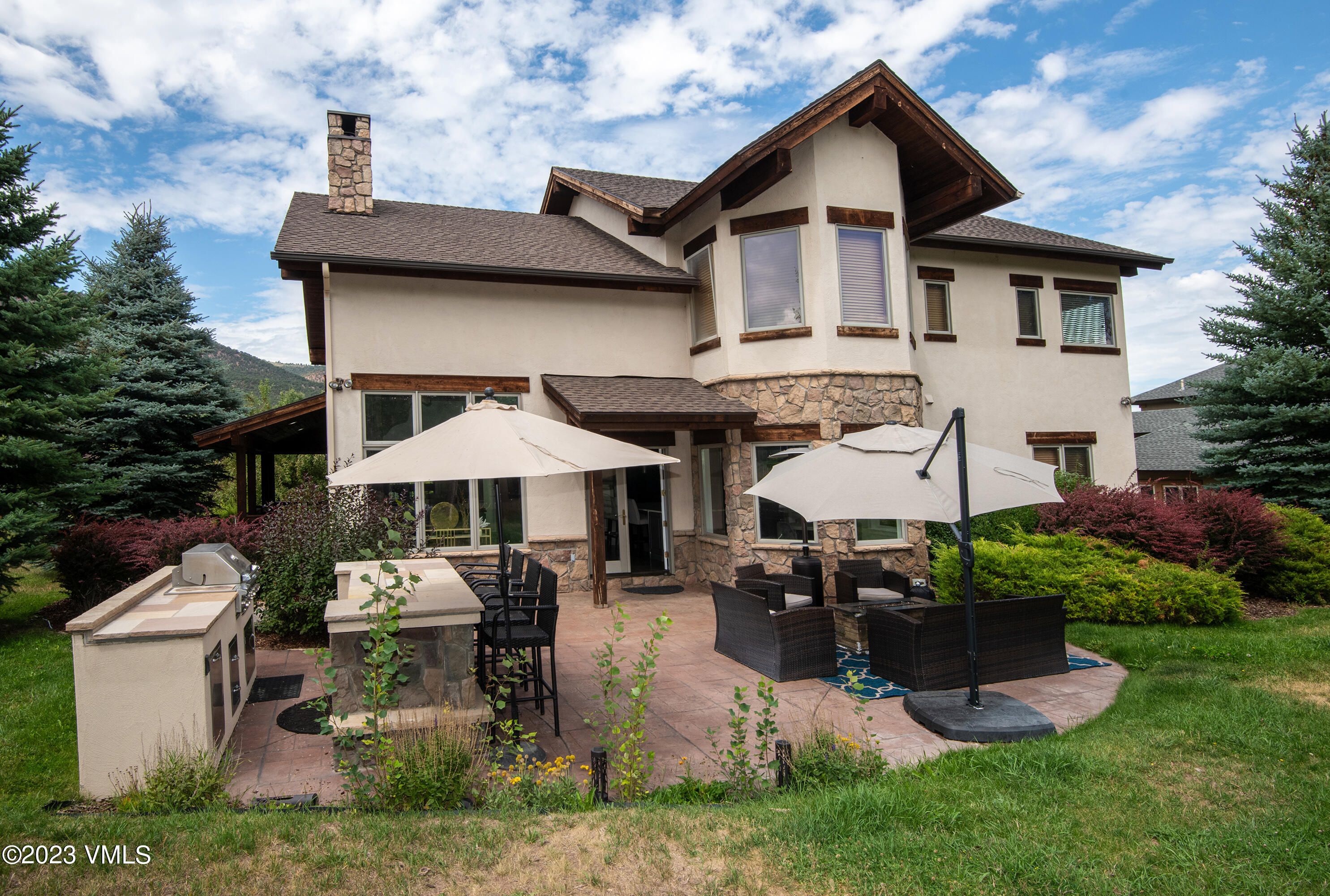 305 Red Fox Gypsum, CO 81637 - Photo 40 of 50 a front view of a house with garden and chairs