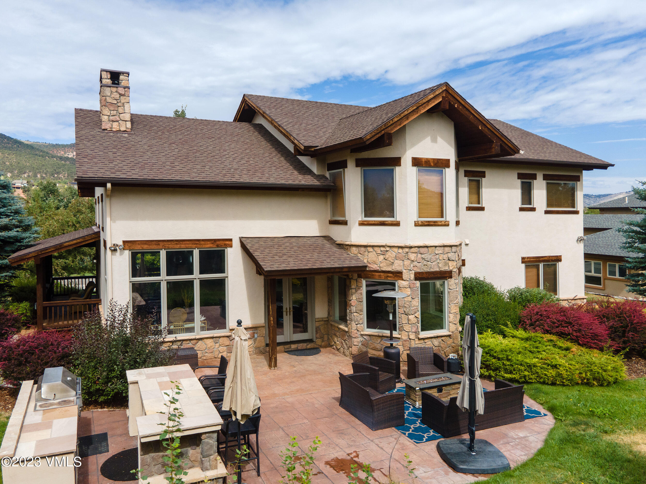 305 Red Fox Gypsum, CO 81637 - Photo 42 of 50 a view of a house with a yard potted plants and a table