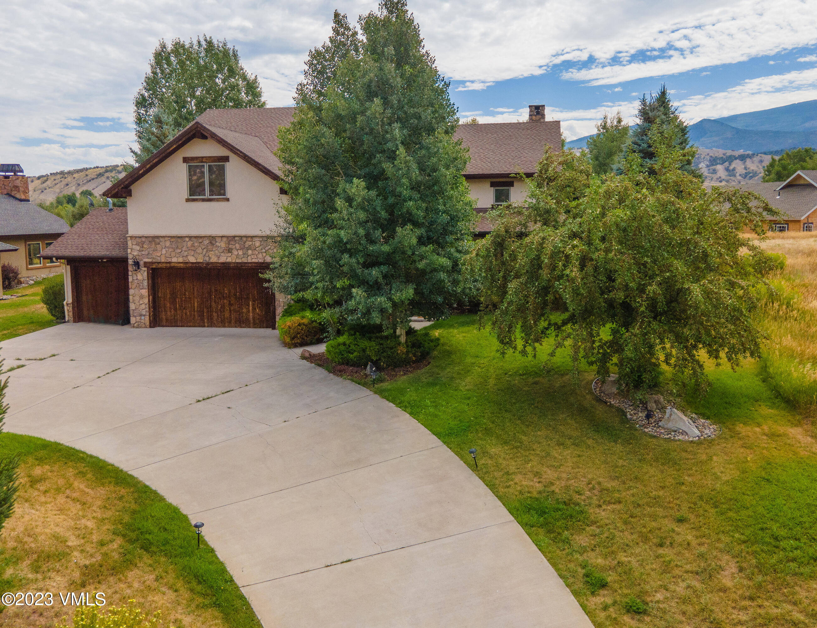 305 Red Fox Gypsum, CO 81637 - Photo 43 of 50 a front view of a house with a garden and yard