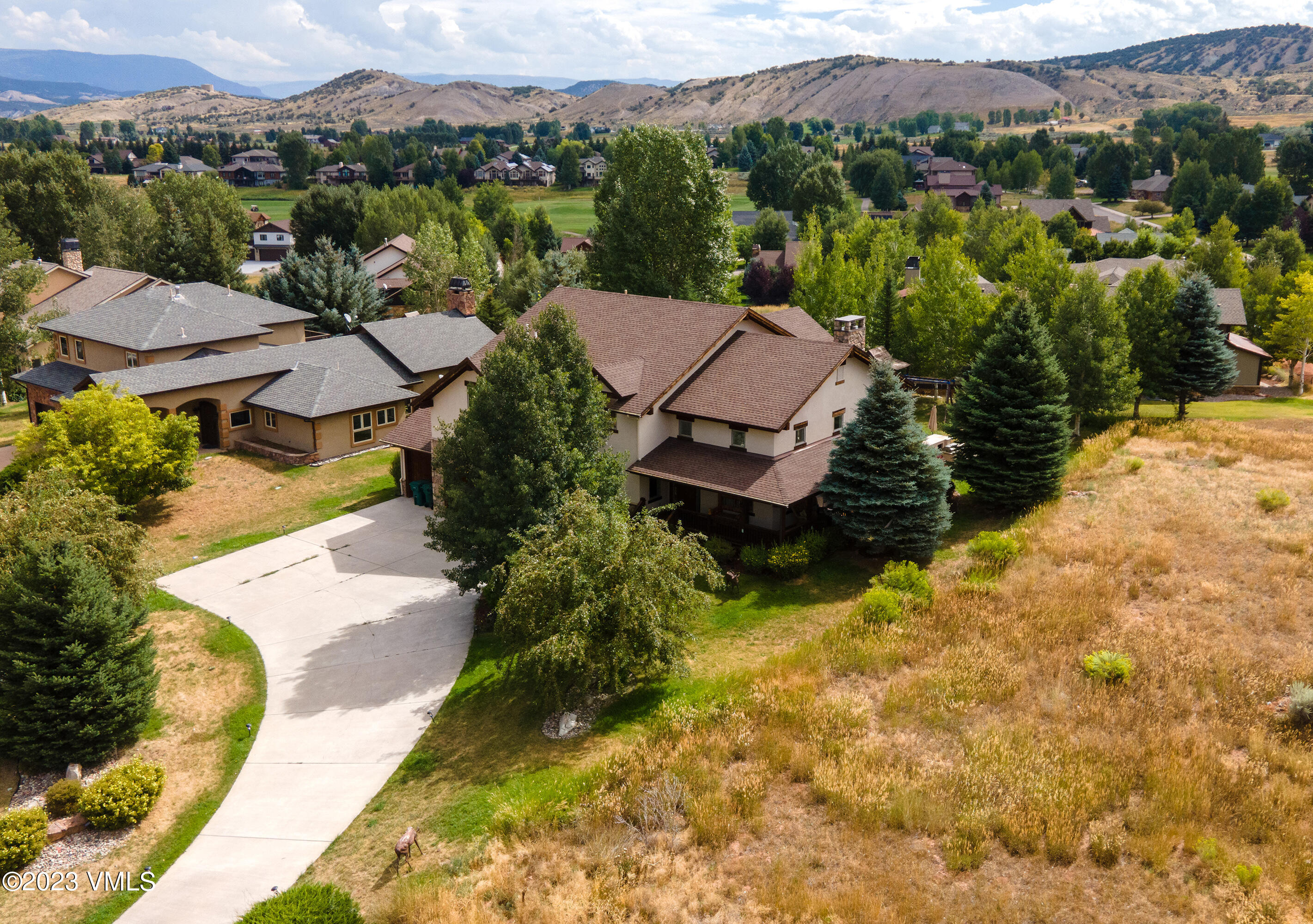 305 Red Fox Gypsum, CO 81637 - Photo 46 of 50 an aerial view of a house with a garden and lake view