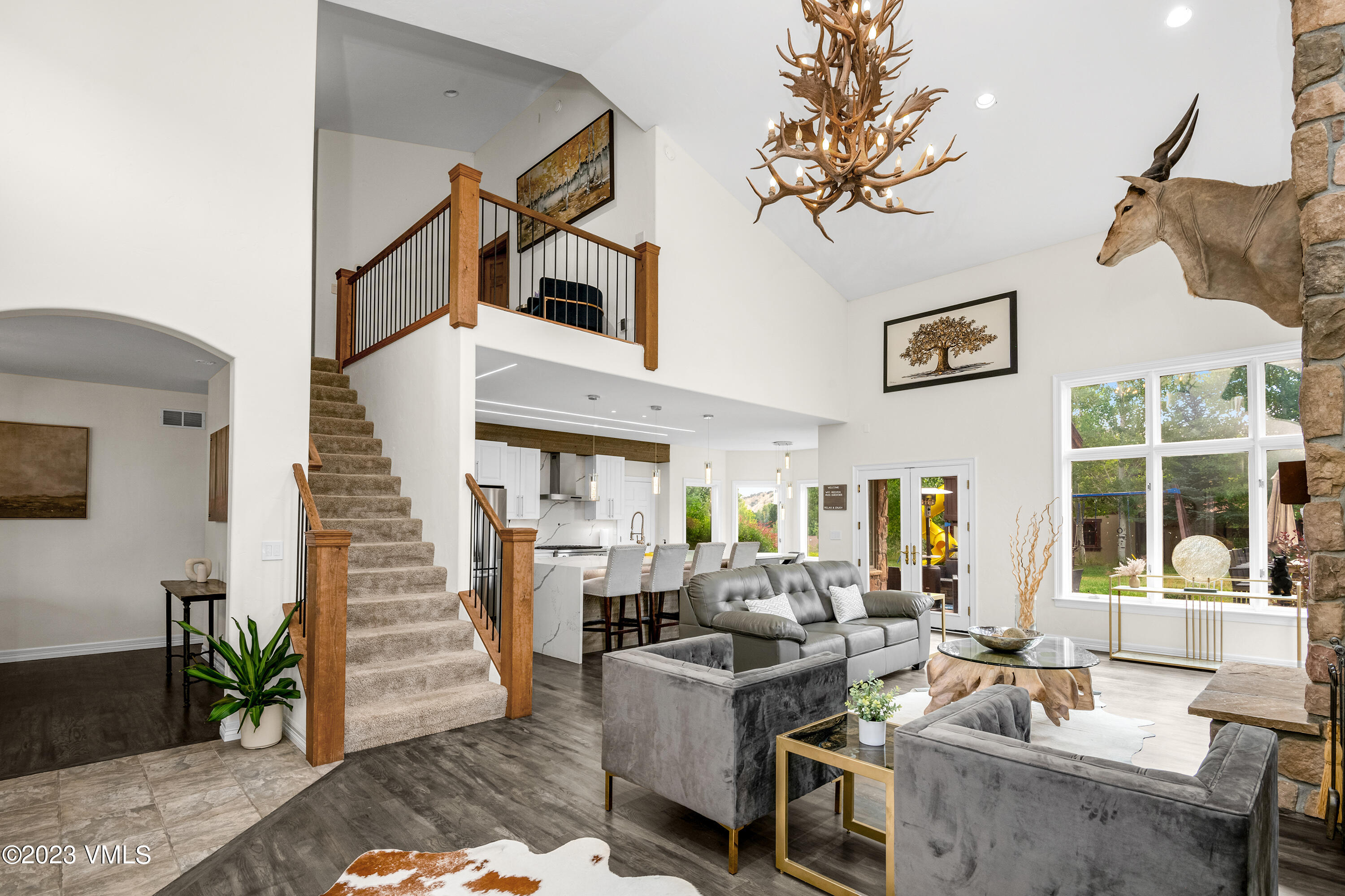 305 Red Fox Gypsum, CO 81637 - Photo 7 of 50 a living room with fireplace furniture and a potted plant