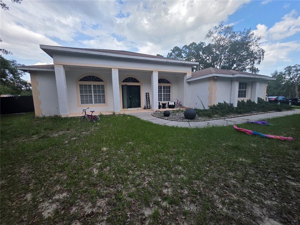 17820 Monteverde Drive Spring Hill, FL 34610 - Photo 2 of 42 a front view of house with yard and green space
