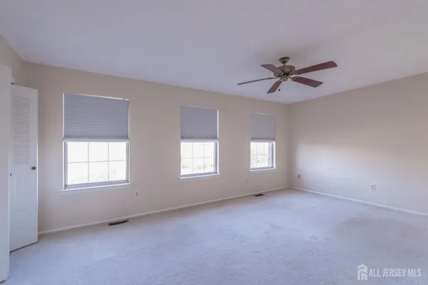 a view of empty room with windows